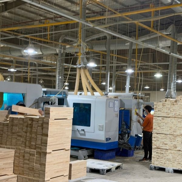 Shaker cabinet manufacturing process in a Vietnam factory using CNC machinery
