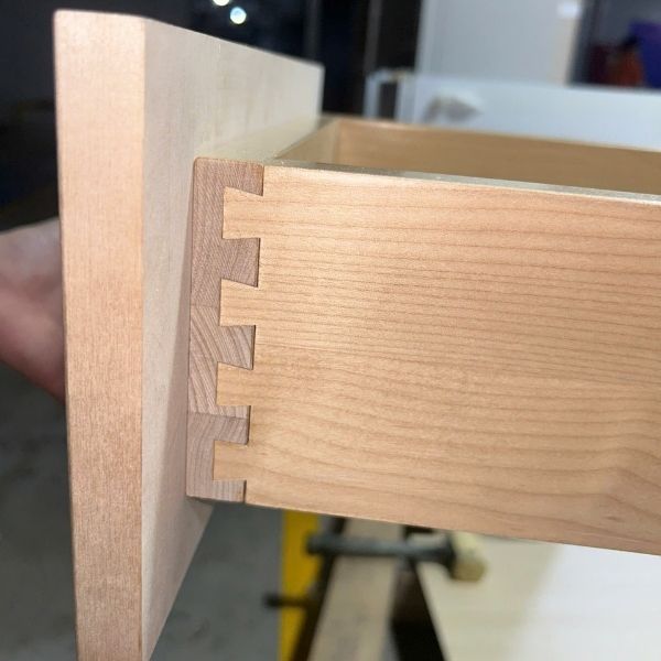 cabinet joinery system using dowel and cam lock construction