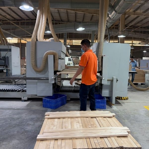 cnc machine cutting cabinet panels in cabinet manufacturing factory