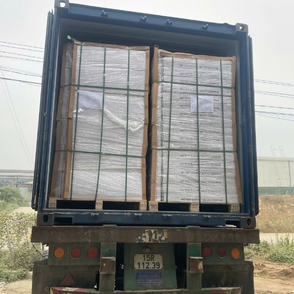 Palletized cabinet units prepared for container loading in large-scale export production facility