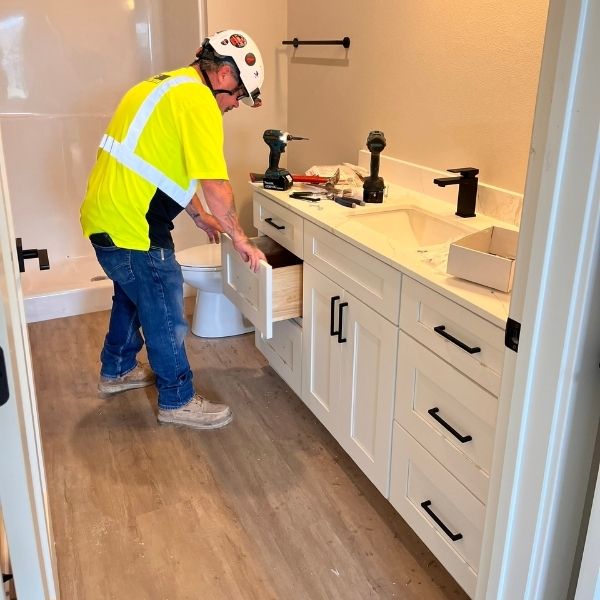 kitchen cabinet installation during residential construction project