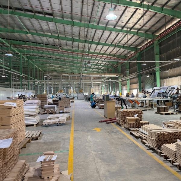 Wide view of modern cabinet manufacturing factory with structured production lines
