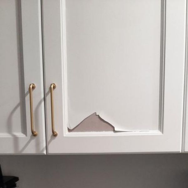 Peeling and damaged painted kitchen cabinets