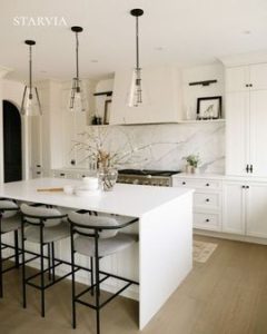 Modern painted kitchen cabinets with white shaker design and quartz countertop