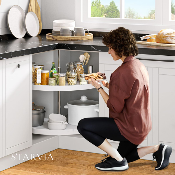 Installer checking blind corner cabinet clearance during kitchen installation