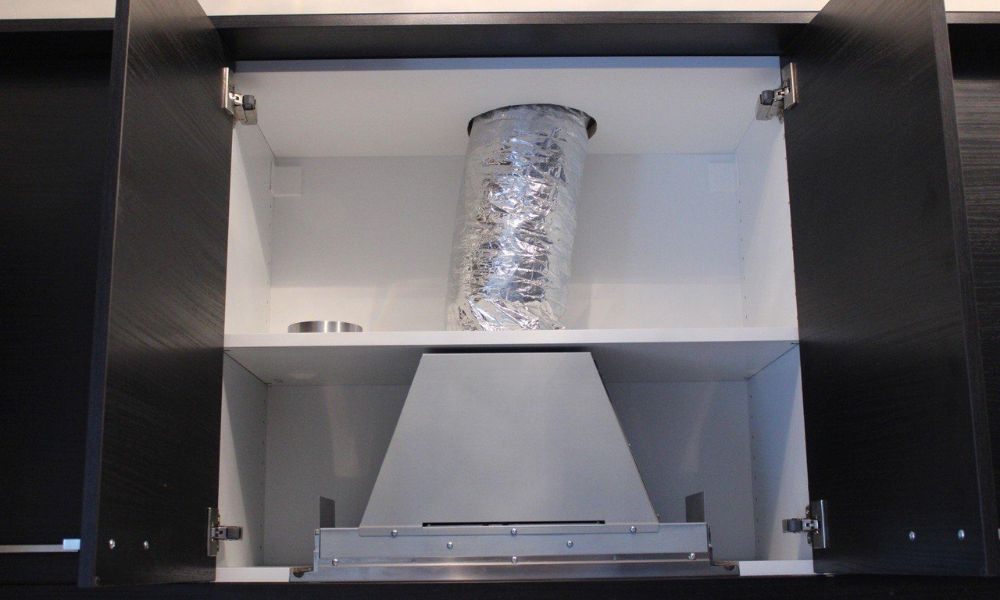 Integrated range hood cabinet duct routing