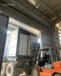 Kitchen cabinet container loading wholesale OEM with flat-pack cabinet cartons stacked inside a 40ft shipping container.